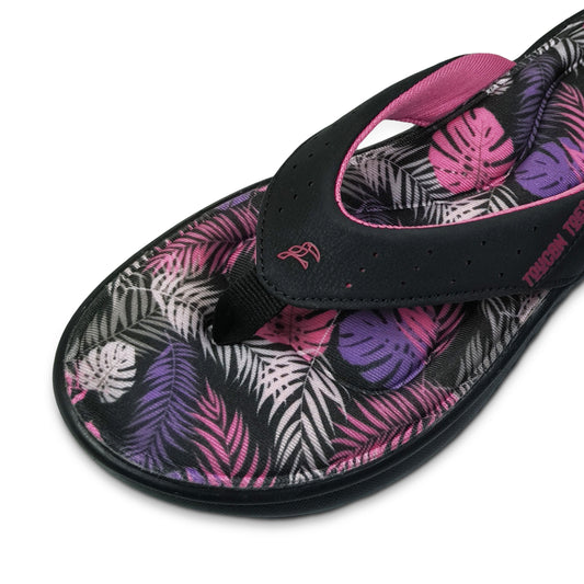 Toucantoes women's flip-flop with black strap and pink tropical leaf print footbed