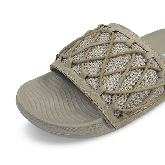 Beige Toucan Toes slide sandal with textured sole and woven strap design, stylish footwear