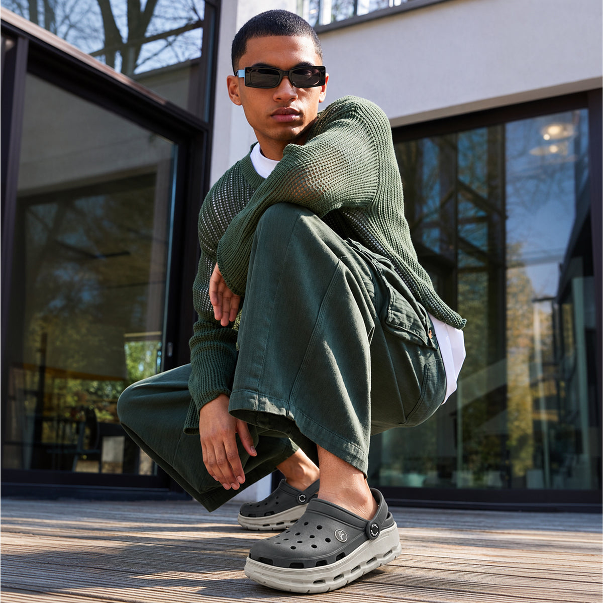 Man wearing Toucantoes Frank grey clogs, lifestyle shot