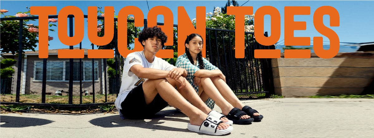 Man and woman in stylish Toucan Toes sandals sitting outdoors, summer footwear fashion promo