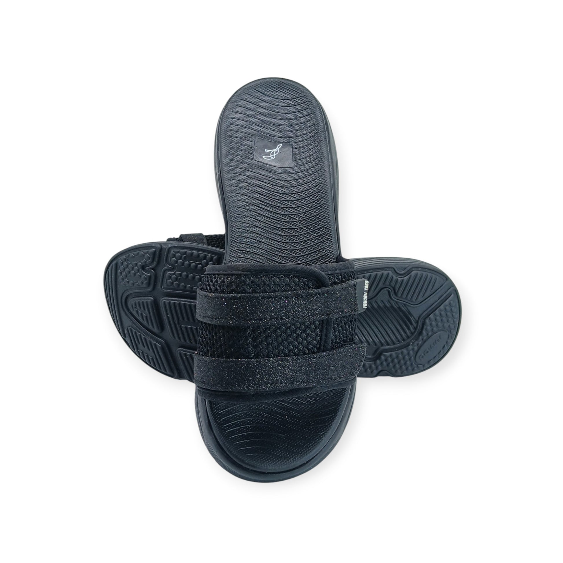 Pair of black adjustable slide sandals with textured soles and mesh straps on white background