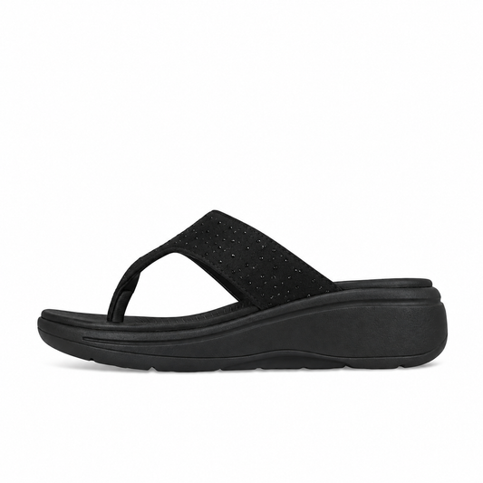 Toucantoes Riva women's flip-flops in black, side view showing the cushioned sole