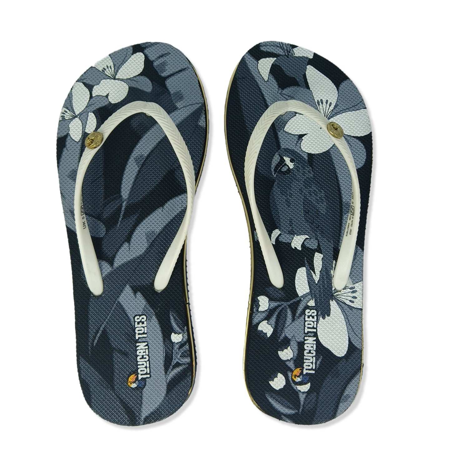 Toucantoes floral print flip-flops with white straps, featuring toucan and flower design
