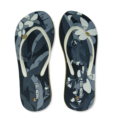 Toucantoes floral print flip-flops with white straps, featuring toucan and flower design