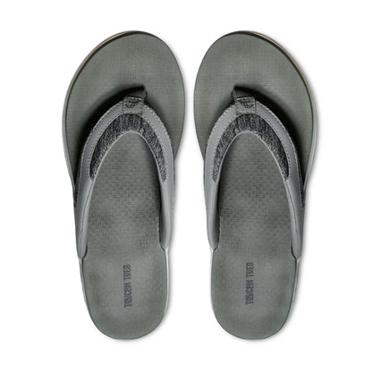 Gray Tough Yuca brand flip-flops with textured footbed and fabric straps, top view