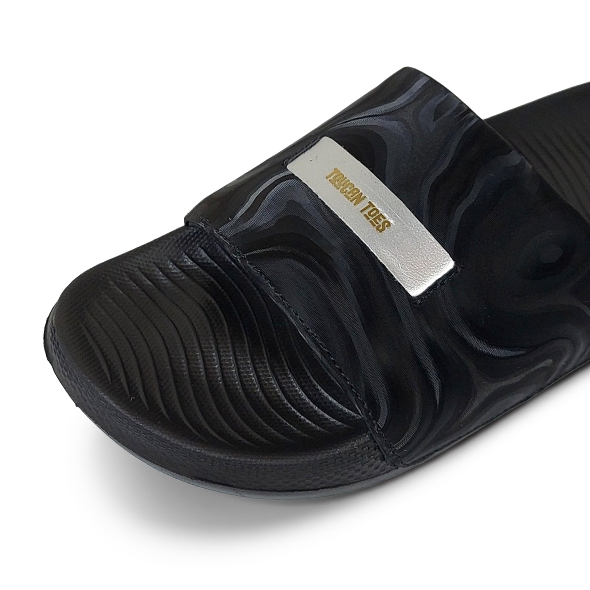 Black Toucantoes slide sandal with textured strap and gold logo, stylish comfortable footwear