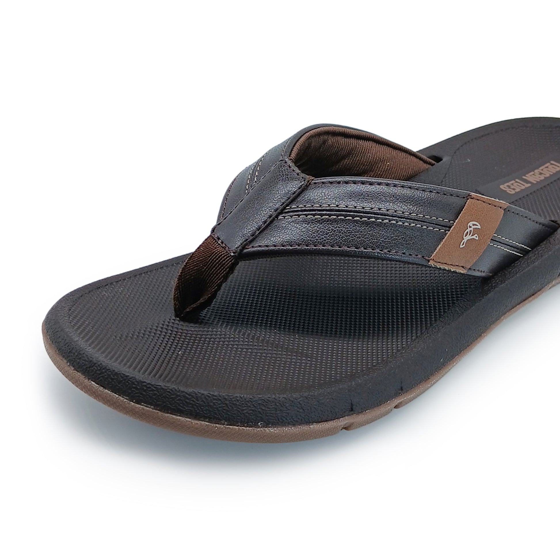 Close-up of black and brown men's casual flip-flop sandal with textured sole and stitched straps