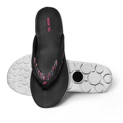 Black and pink Toucan Tides flip-flops with textured sole and circular grip pattern