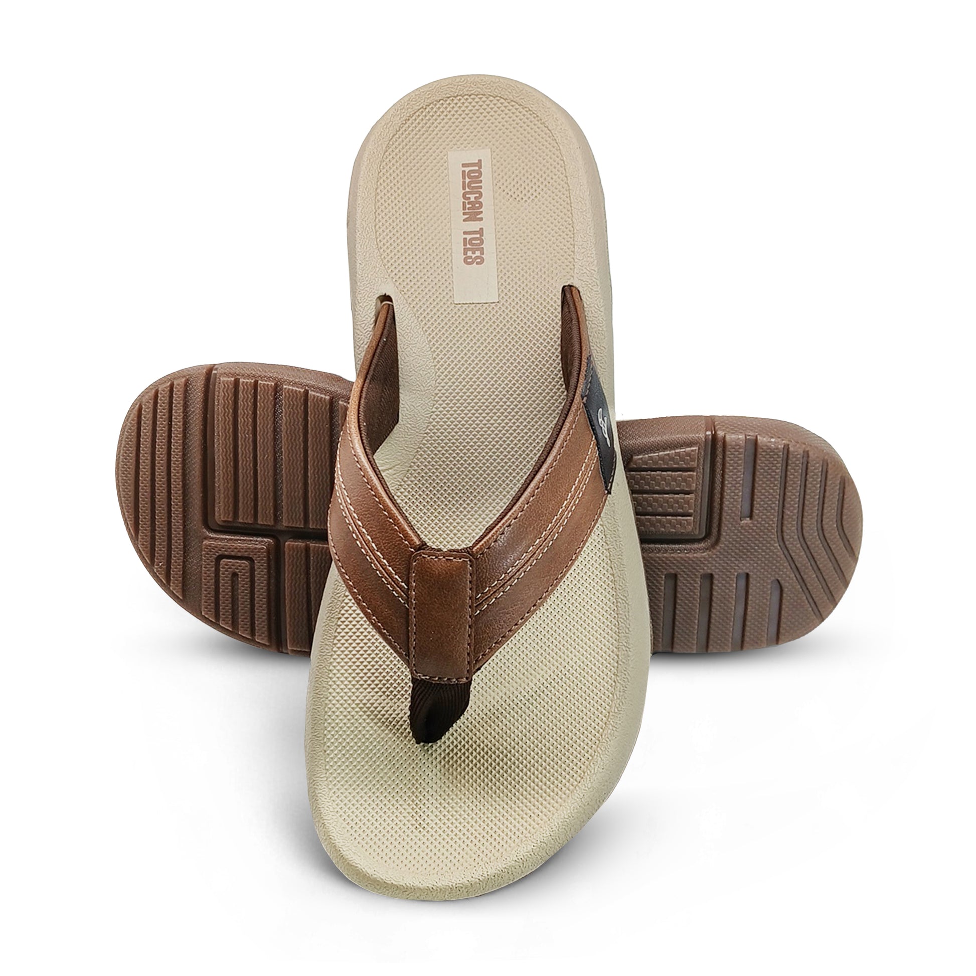 brown leather thong sandals with beige textured footbed and patterned rubber outsole on white background