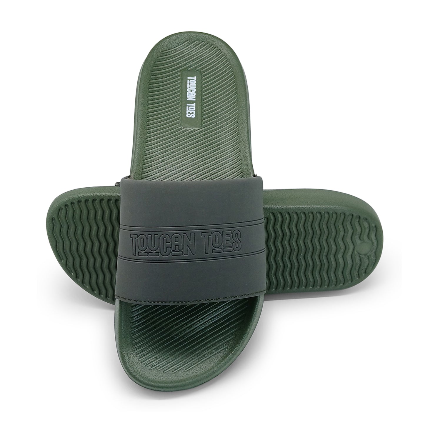 Green and black Toucan Toes slide sandals with textured soles on white background