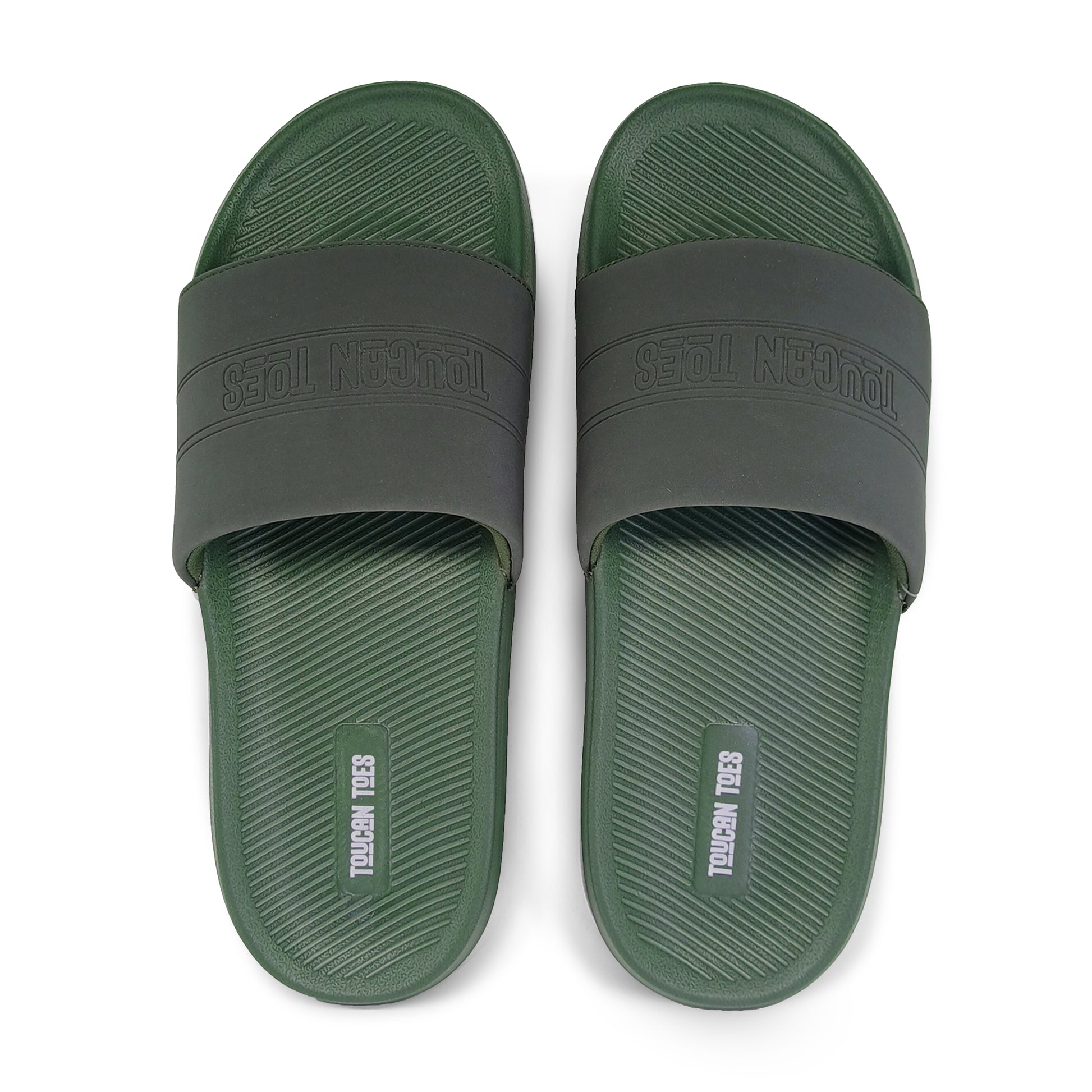 Top view of green and black Toucan Toes slide sandals with textured footbed