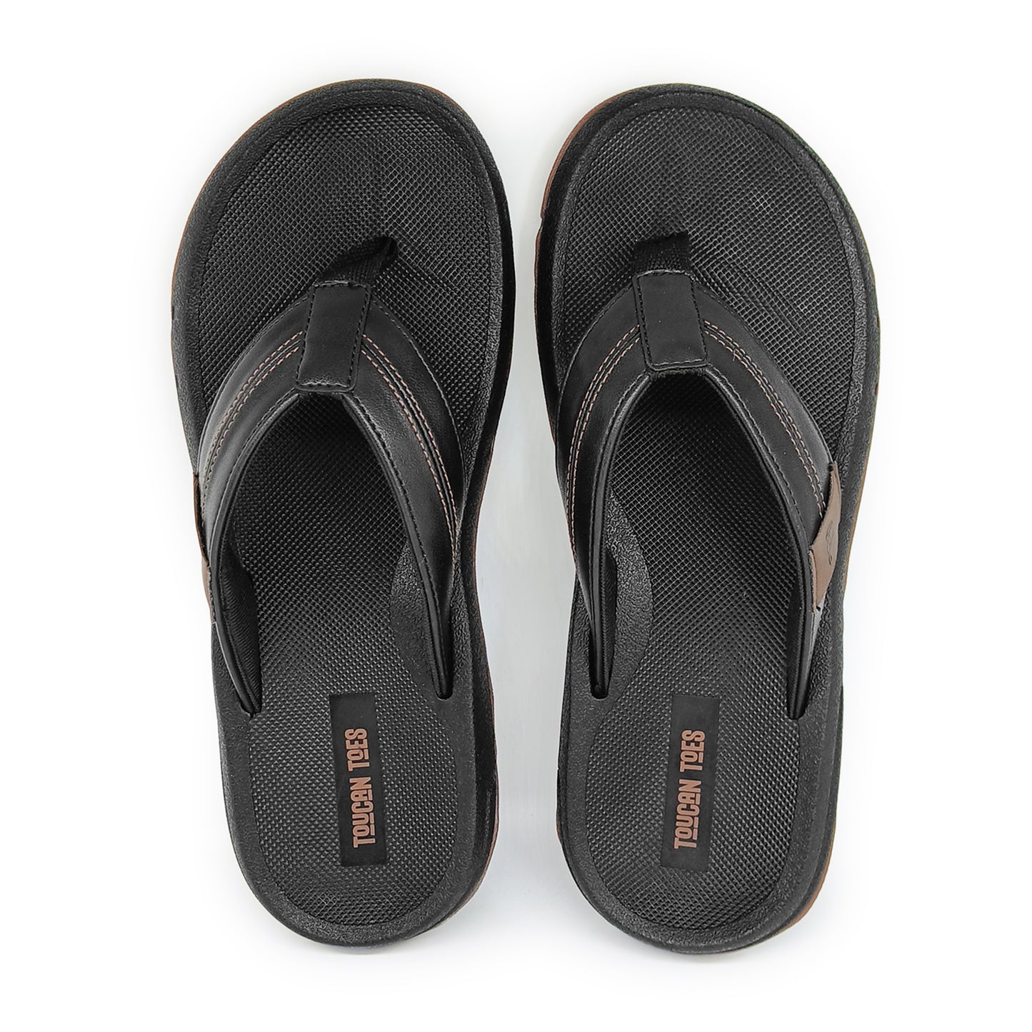 Pair of black Toucan Toes flip-flop sandals with textured footbed and leather-like straps