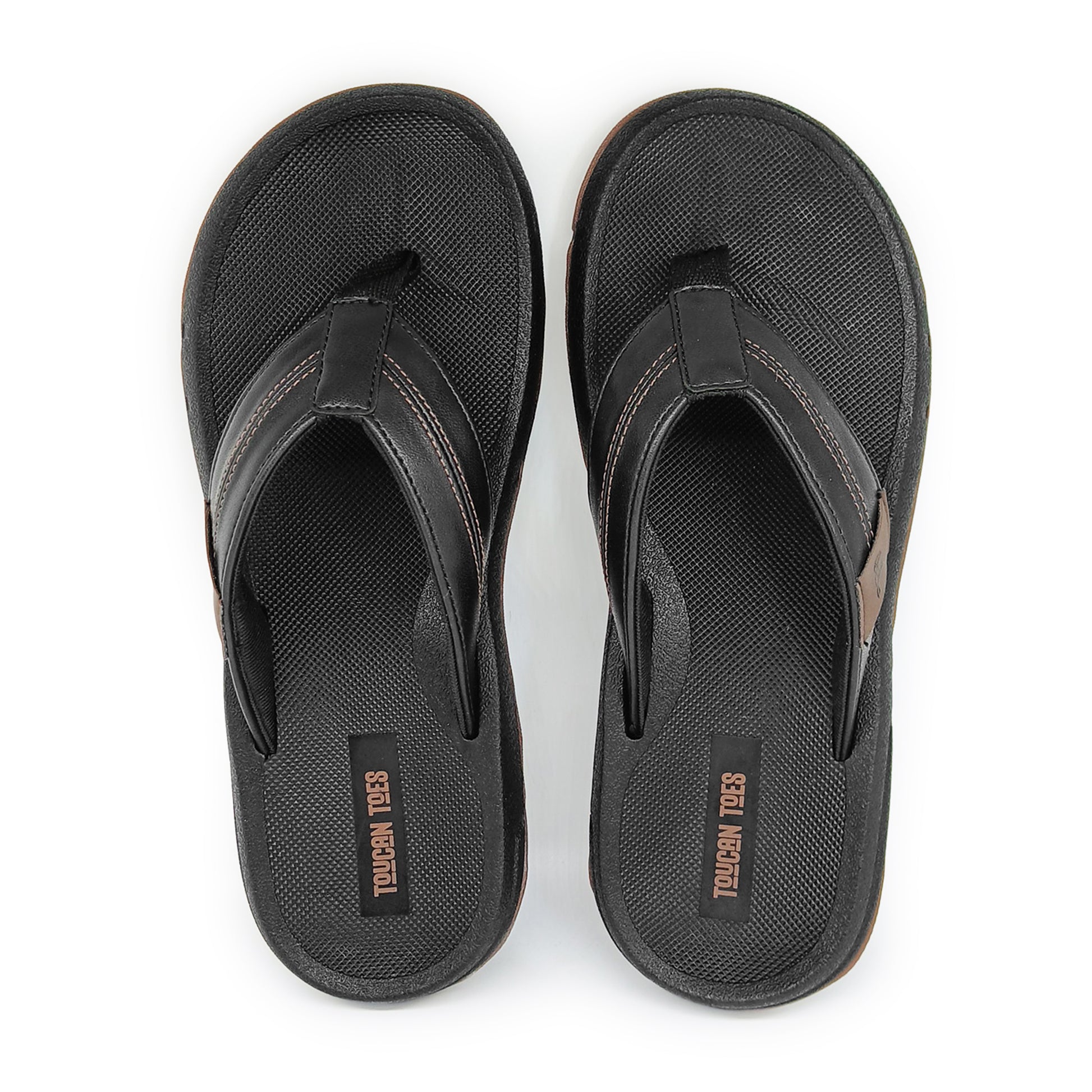Pair of black Toucan Toes flip-flop sandals with textured footbed and leather-like straps