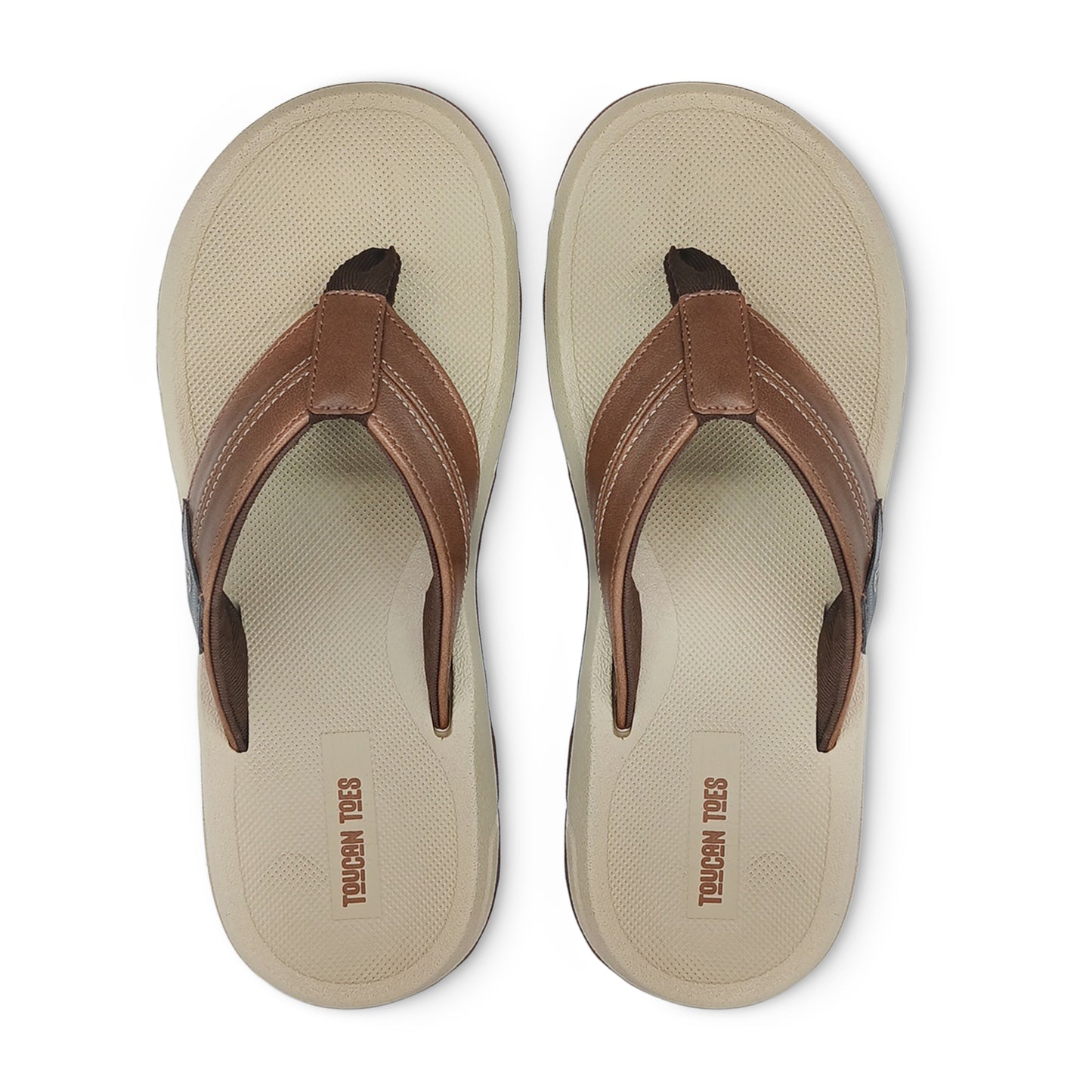 Pair of beige and brown casual Toucan Toes flip-flops with textured footbed, top view