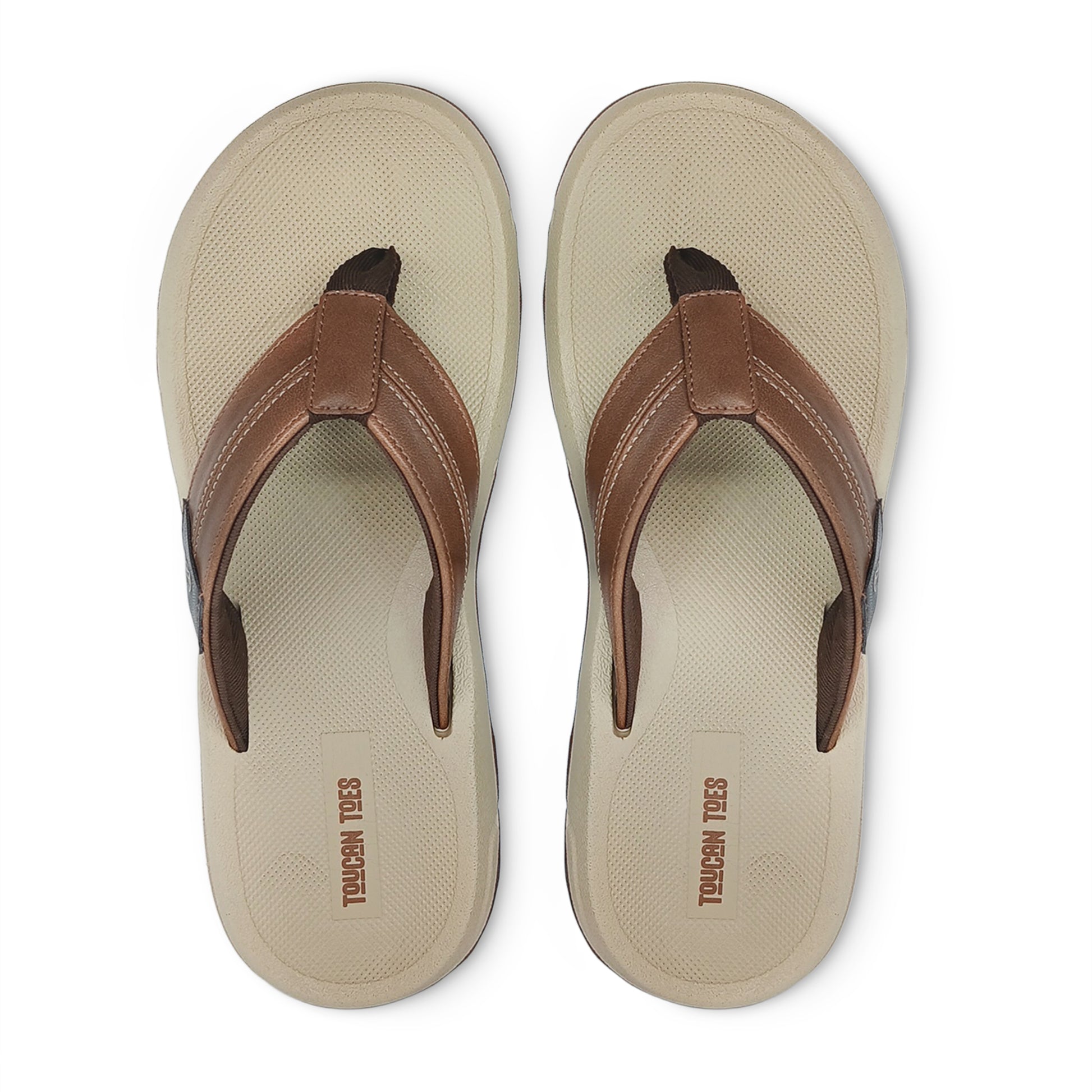 Pair of beige and brown casual Toucan Toes flip-flops with textured footbed, top view
