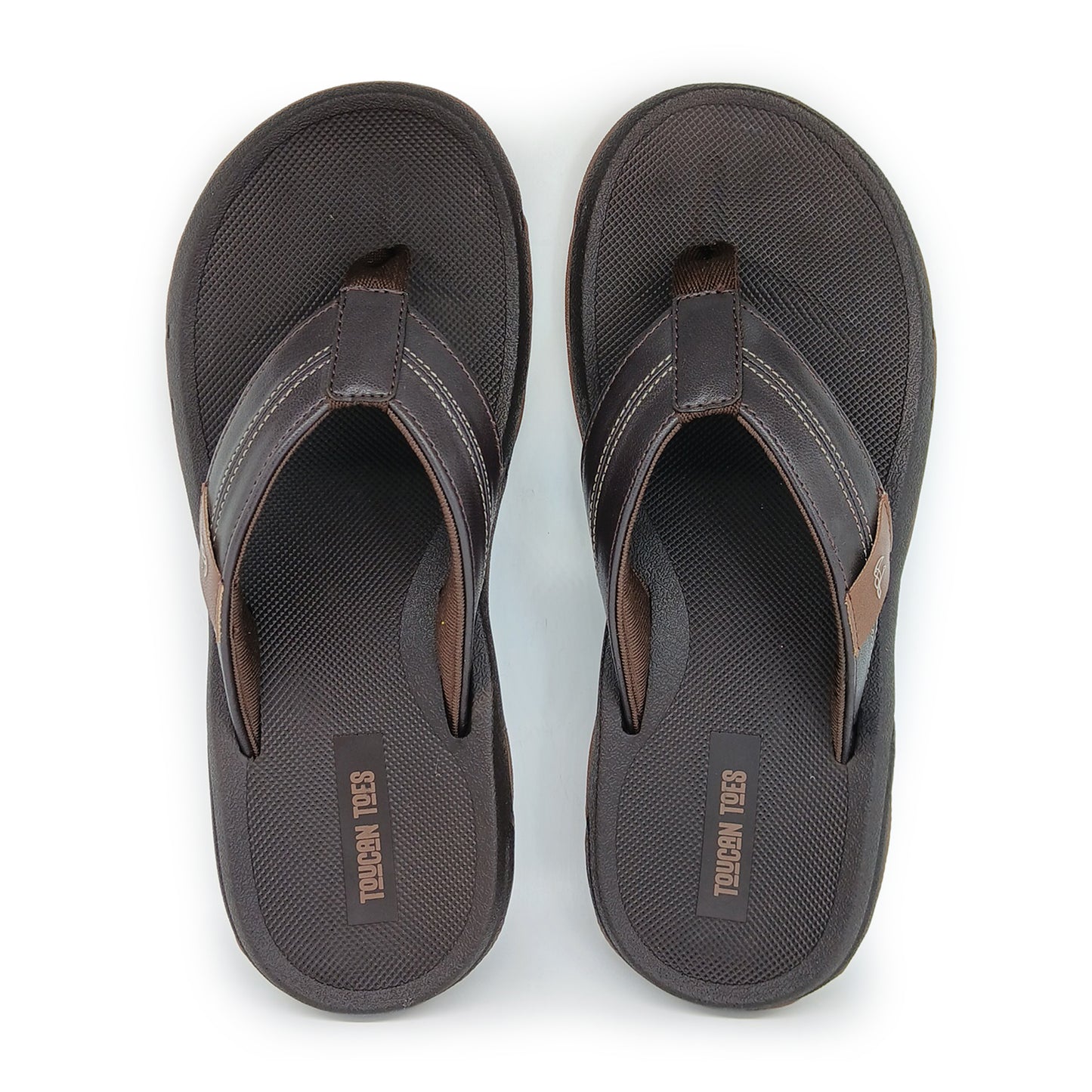 Pair of brown Toucan Toes men's flip flops with cushioned soles on white background