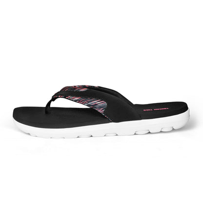 Black and white cushioned flip flop sandal with pink patterned strap and textured footbed