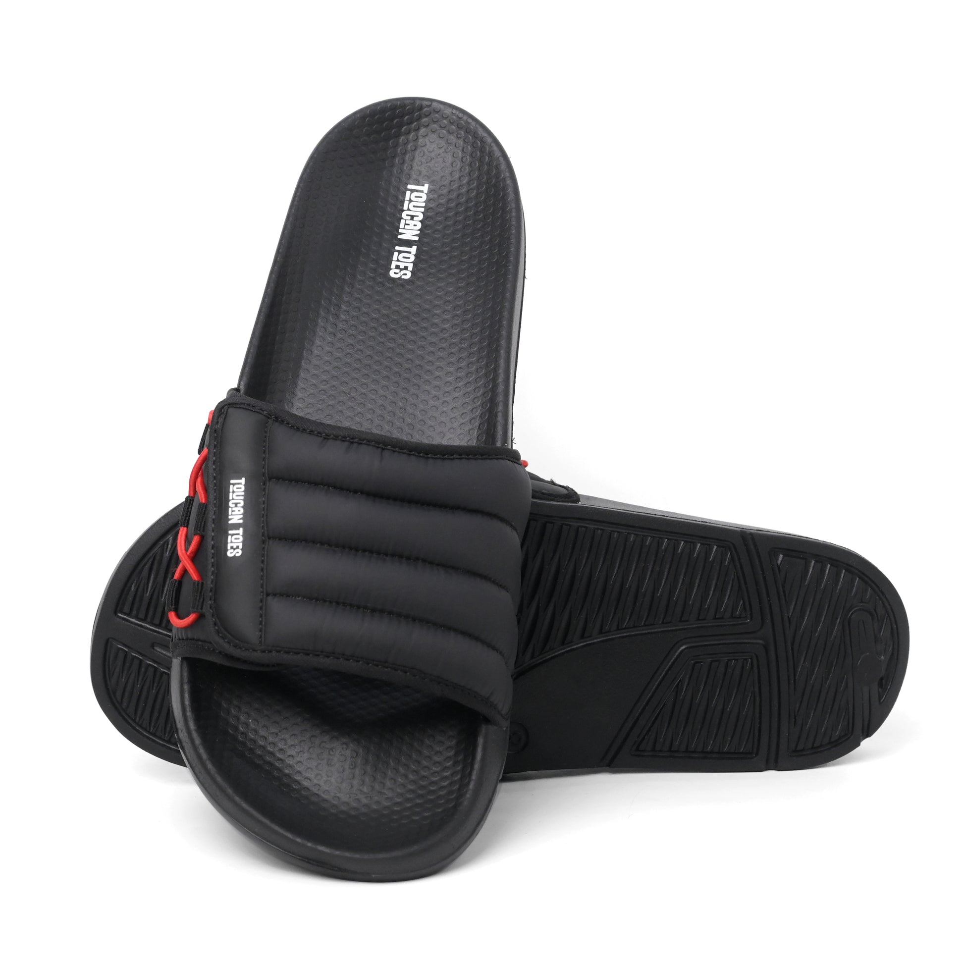 Toucantoes black slide sandals with cushioned strap and red lace detail, durable sole