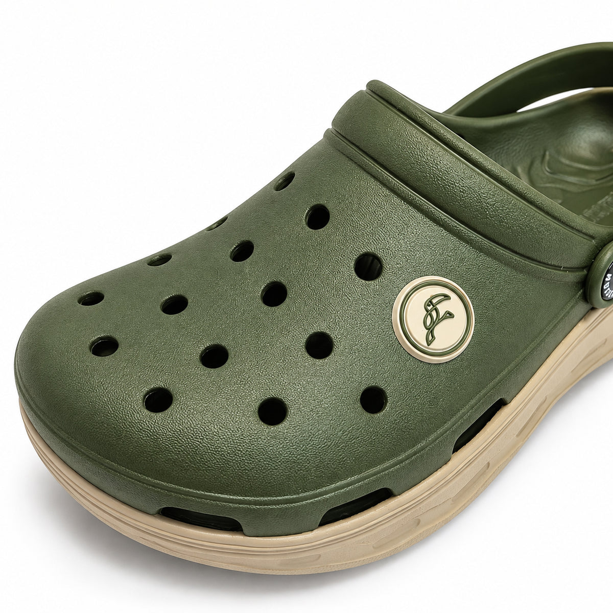 Close-up of the Toucantoes Frank olive clog upper with ventilation holes