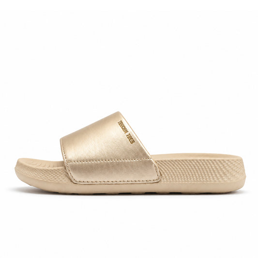 Toucantoes Sophie women's slides in beige, side view showing the cushioned sole