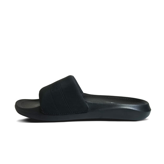 Black slide sandal with thick strap and textured footbed isolated on white background