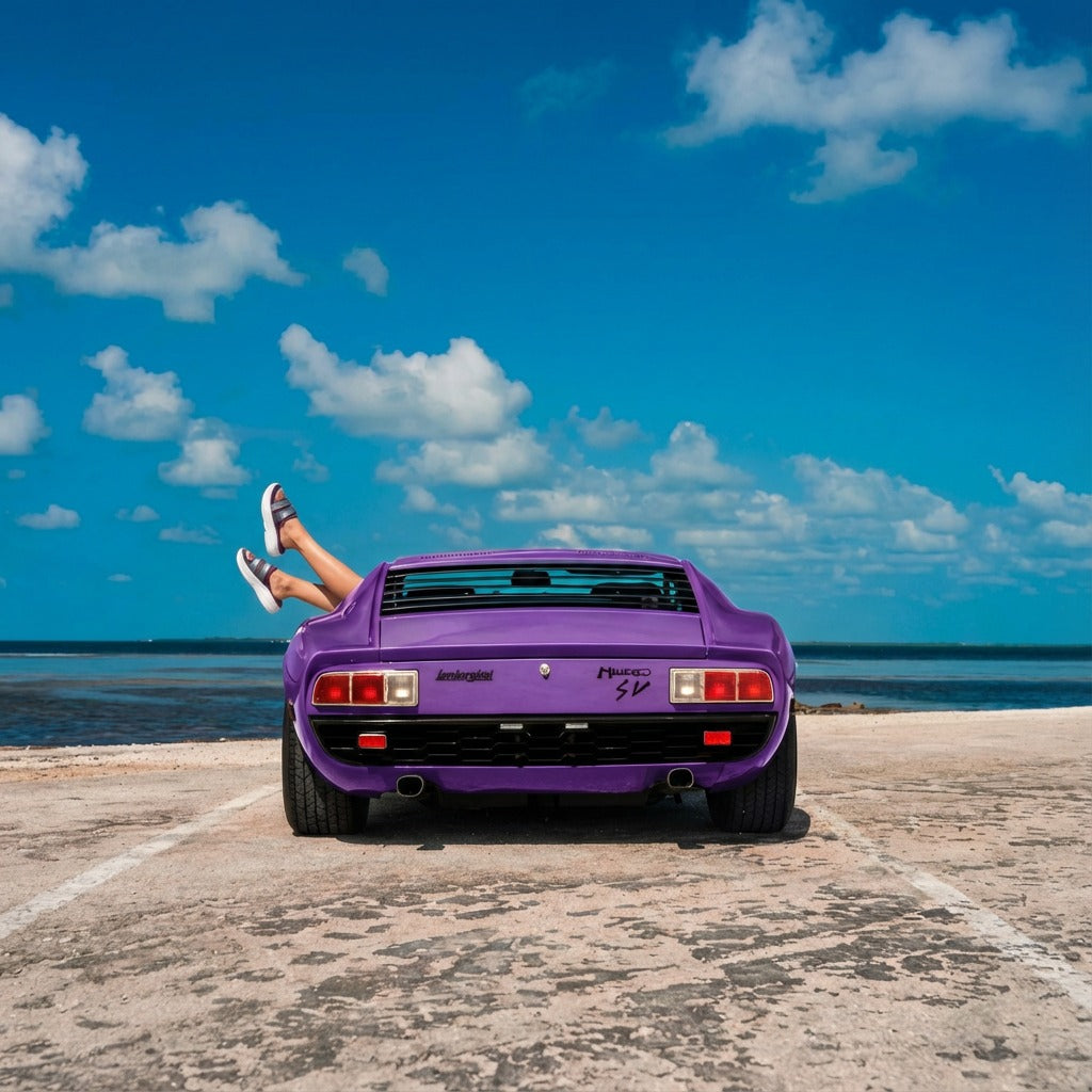 Person wearing Toucan Toes sandals relaxing in a purple sports car by the beach