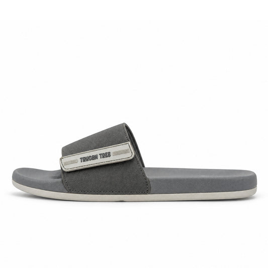 Toucantoes Bruce men's slides in grey, side view showing the cushioned sole