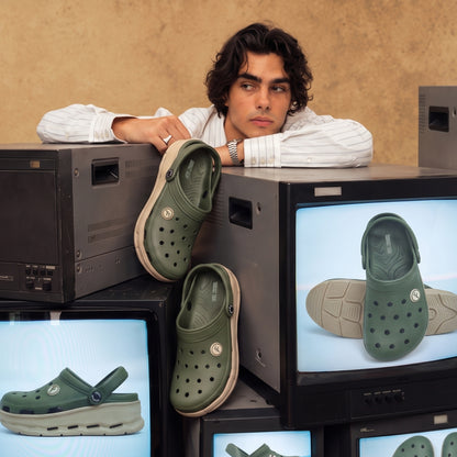Man wearing Toucantoes Frank olive clogs, lifestyle shot